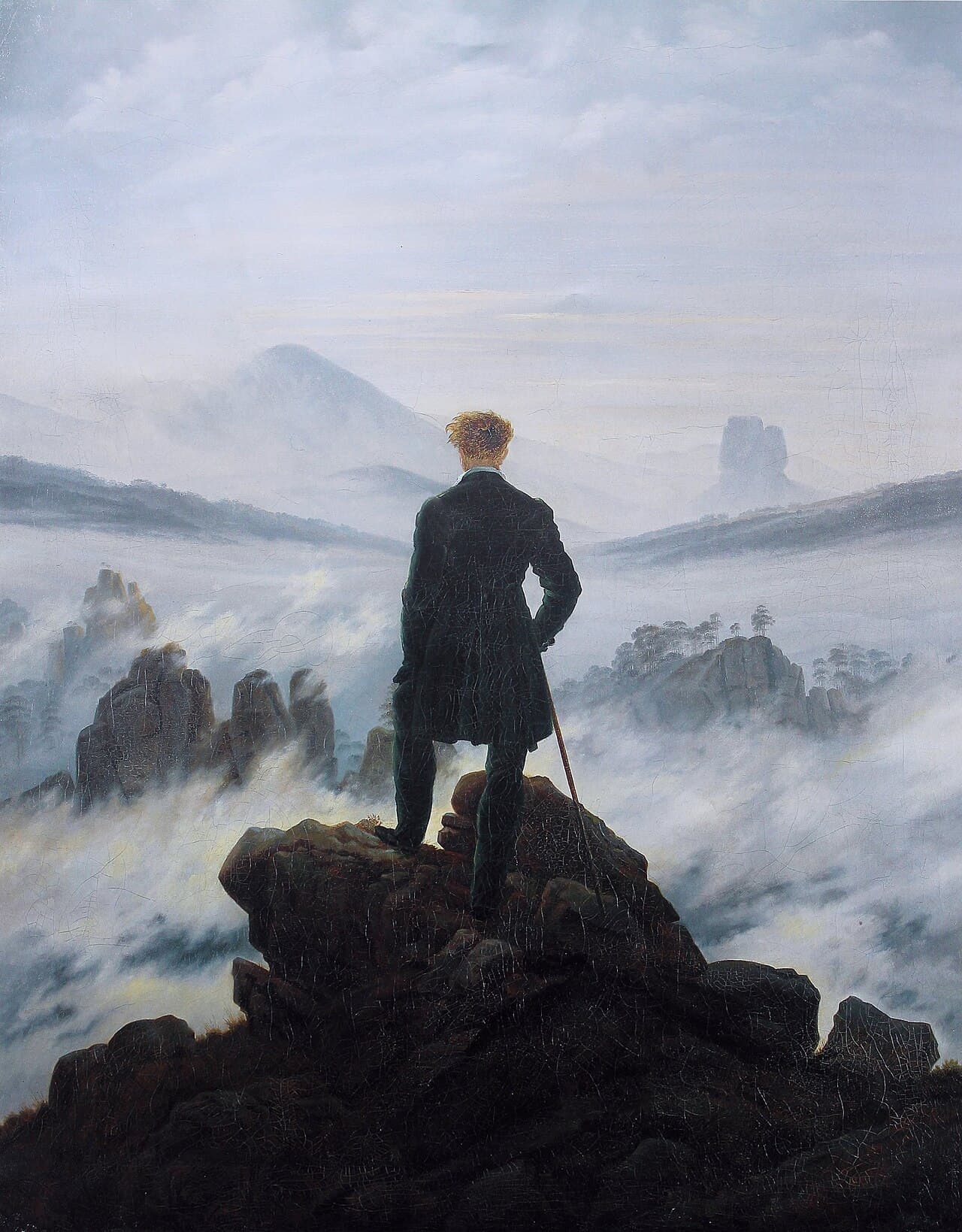 Wanderer above the Sea of Fog by Caspar David Friedrich — a figure standing on a rocky precipice, gazing over a sea of clouds